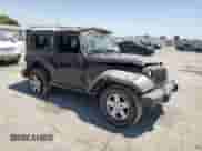 2011 Jeep Wrangler Rubicon with VIN 1J4HA6D17BL574211, listed as a Copart auction lot 64483405 with 95,777 mi miles and Salvage title. Bid and sale history available at DreamBid. Image 4.