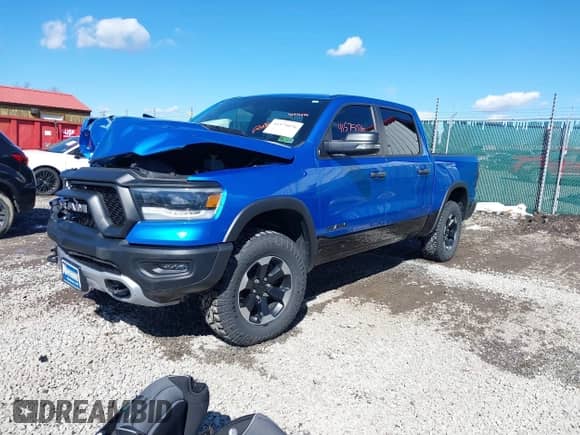 2022 Ram 1500 Rebel z VIN 1C6SRFLT0NN177124, wystawiony jako IAAI lot #41575076 z przebiegiem 40 065 mil mil oraz . Historia ofert i sprzedaży dostępna na DreamBid. Obrazek 2.