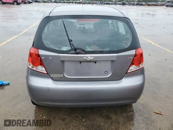 2007 Chevrolet Aveo LS z VIN KL1TD66607B738726, wystawiony jako Copart lot #73238484 z przebiegiem Nie podano mil oraz Szkoda całkowita • Salvage title. Historia ofert i sprzedaży dostępna na DreamBid. Obrazek 6.