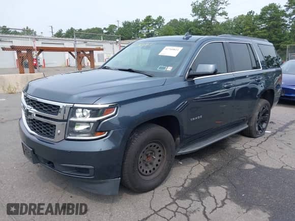 2019 Chevrolet Tahoe LS with VIN 1GNSCAKC5KR188730, listed as a IAAI auction lot 42760811 with 183,487 mi miles and . Bid and sale history available at DreamBid. Image 2.