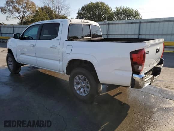 2020 Toyota Tacoma SR with VIN 5TFAX5GN3LX165499, listed as a Copart auction lot 84973885 with 67,043 mi miles and Salvage title. Bid and sale history available at DreamBid. Image 2.