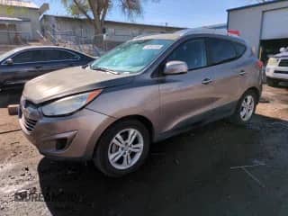 2011 Hyundai Tucson Limited with VIN KM8JUCAC1BU309681, listed as a Copart auction lot 54552335 with 180,444 mi miles and Salvage title. Bid and sale history available at DreamBid. Image 1.