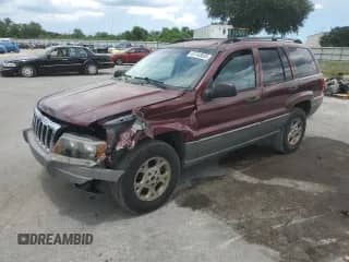 2002 Jeep Grand Cherokee Laredo with VIN 1J4GX48SX2C141273, listed as a Copart auction lot 80718395 with 137,248 mi miles and Non repairable. Bid and sale history available at DreamBid. Image 1.
