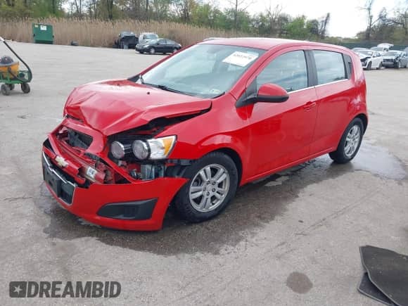 2012 Chevrolet Sonic LT with VIN 1G1JC6SB1C4226485, listed as a IAAI auction lot 42022970 with 105,582 mi miles and . Bid and sale history available at DreamBid. Image 2.