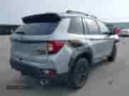 2023 Honda Passport TrailSport z VIN 5FNYF8H66PB044234, wystawiony jako IAAI lot #42462611 z przebiegiem 6 411 mil mil oraz . Historia ofert i sprzedaży dostępna na DreamBid. Obrazek 4.