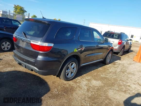 2013 Dodge Durango SXT with VIN 1C4RDJAG1DC695624, listed as a IAAI auction lot 43134491 with 219,799 mi miles and . Bid and sale history available at DreamBid. Image 4.