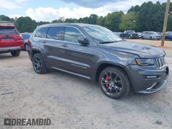 2014 Jeep Grand Cherokee SRT-8 with VIN 1C4RJFDJ1EC400567, listed as a IAAI auction lot 43222133 with 127,427 mi miles and . Bid and sale history available at DreamBid. Image 1.