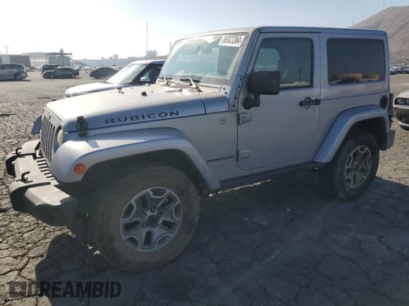 2014 Jeep Wrangler Rubicon with VIN 1C4BJWCG7EL206665, listed as a Copart auction lot 86903384 with 413,442 mi miles and Salvage title. Bid and sale history available at DreamBid. Image 1.