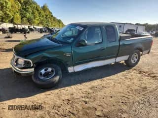 1999 Ford F-150 XL с VIN 1FTRX17L1XNA63324, выставлен на аукционе Copart как лот 87388335 с пробегом Не указан миль и Списание • Salvage title. История ставок и продаж доступна на DreamBid. Изображение 1.