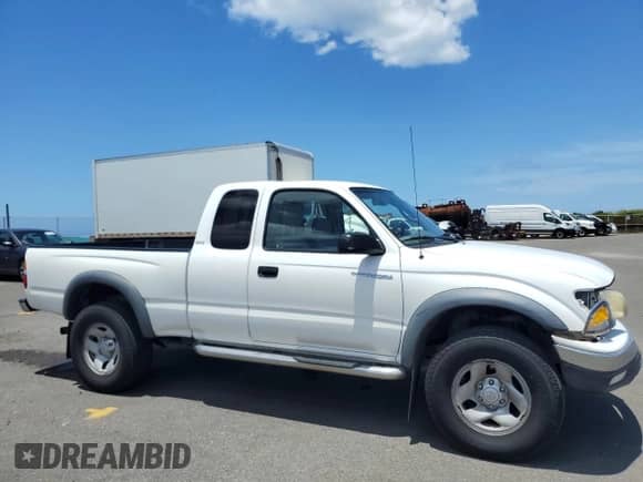 2003 Toyota Tacoma PreRunner with VIN 5TESM92N33Z208971, listed as a Copart auction lot 65647325 with 163,509 mi miles and Salvage title. Bid and sale history available at DreamBid. Image 4.
