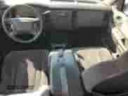 2001 Dodge Dakota Sport с VIN 1B7HL2AX81S343985, выставлен на аукционе Copart как лот 82498565 с пробегом 247 286 миль миль и Списание • Salvage title. История ставок и продаж доступна на DreamBid. Изображение 8.