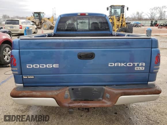 2004 Dodge Dakota SLT с VIN 1D7GL42N44S679924, выставлен на аукционе Copart как лот 85267954 с пробегом 155 295 миль миль и Списание • Salvage title. История ставок и продаж доступна на DreamBid. Изображение 6.