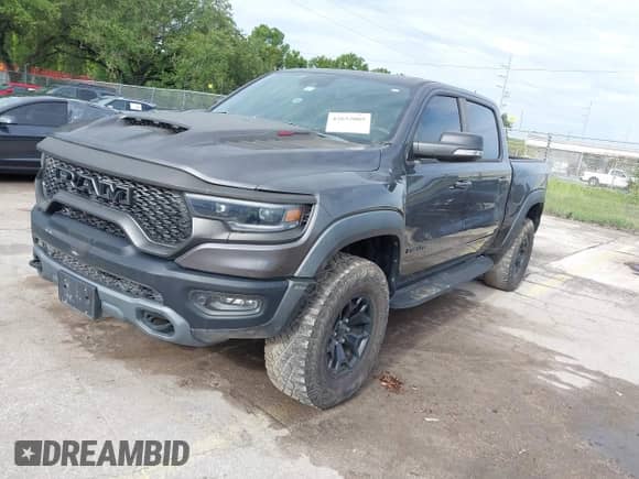 2021 Ram 1500 TRX z VIN 1C6SRFU98MN820577, wystawiony jako IAAI lot #42652005 z przebiegiem 43 429 mil mil oraz . Historia ofert i sprzedaży dostępna na DreamBid. Obrazek 17.