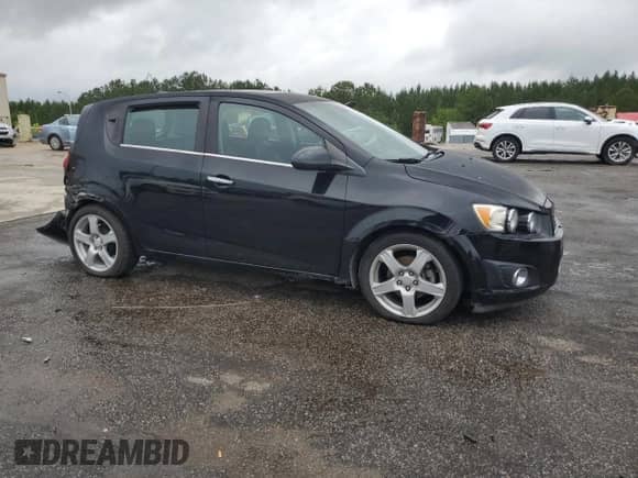 2012 Chevrolet Sonic LTZ with VIN 1G1JE6SH1C4132511, listed as a Copart auction lot 58445765 with 82,611 mi miles and Salvage title. Bid and sale history available at DreamBid. Image 4.