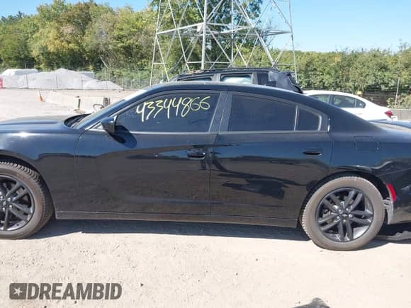 2019 Dodge Charger SXT with VIN 2C3CDXJG6KH743223, listed as a IAAI auction lot 43344866 with 55,661 mi miles and . Bid and sale history available at DreamBid. Image 14.