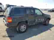 1998 Jeep Grand Cherokee Limited z VIN 1J4GZ78Y5WC185820, wystawiony jako Copart lot #67221725 z przebiegiem 280 414 mil mil oraz Szkoda całkowita • Salvage title. Historia ofert i sprzedaży dostępna na DreamBid. Obrazek 3.