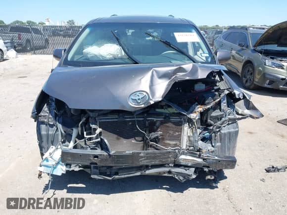 2012 Toyota Sienna SE with VIN 5TDXK3DC5CS232979, listed as a IAAI auction lot 43136504 with 198,231 mi miles and . Bid and sale history available at DreamBid. Image 12.