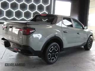 2022 Hyundai Santa Cruz SEL с VIN 5NTJBDAEXNH026424, выставлен на аукционе Copart как лот 84966165 с пробегом 50 074 миль миль и На запчасти • Non repairable. История ставок и продаж доступна на DreamBid. Изображение 3.