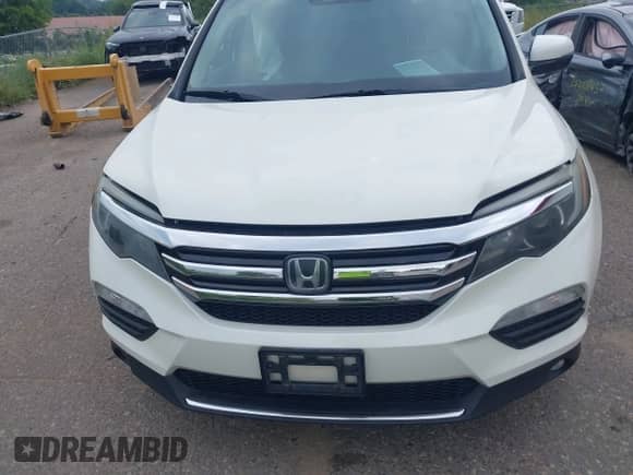 2016 Honda Pilot Touring с VIN 5FNYF6H90GB028724, выставлен на аукционе IAAI как лот 43005091 с пробегом 170 050 миль миль и . История ставок и продаж доступна на DreamBid. Изображение 12.