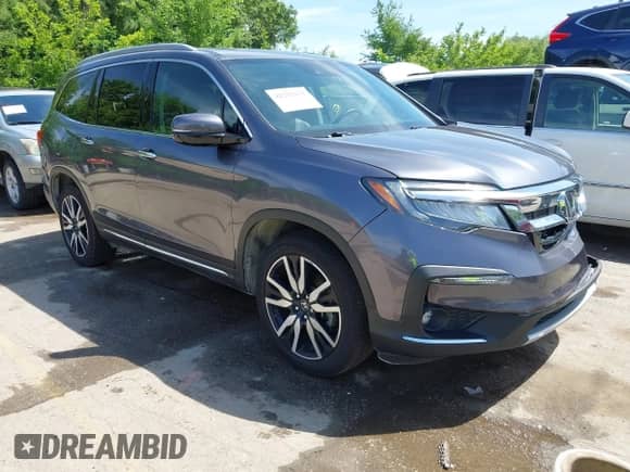 2021 Honda Pilot Touring 7-Passenger with VIN 5FNYF6H66MB081767, listed as a IAAI auction lot 42221152 with 74,029 mi miles and . Bid and sale history available at DreamBid. Image 1.