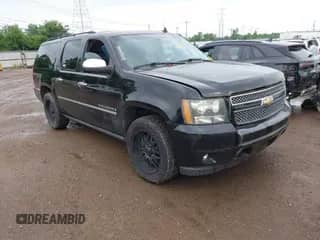 2009 Chevrolet Suburban LTZ z VIN 1GNFK36399R290858, wystawiony jako IAAI lot #42738830 z przebiegiem 214 790 mil mil oraz . Historia ofert i sprzedaży dostępna na DreamBid. Obrazek 1.