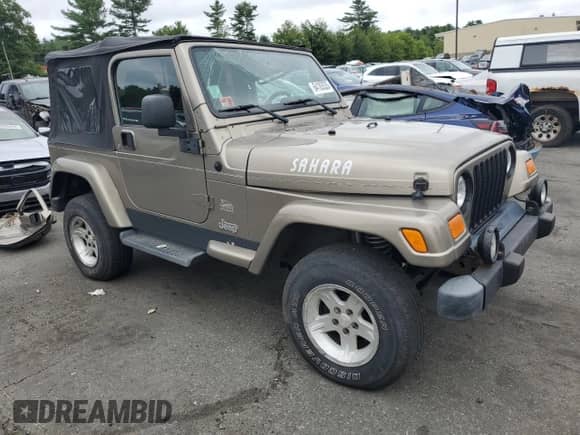 2004 Jeep Wrangler Sahara с VIN 1J4FA59S84P801582, выставлен на аукционе Copart как лот 64183535 с пробегом 127 213 миль миль и Списание • Salvage title. История ставок и продаж доступна на DreamBid. Изображение 4.