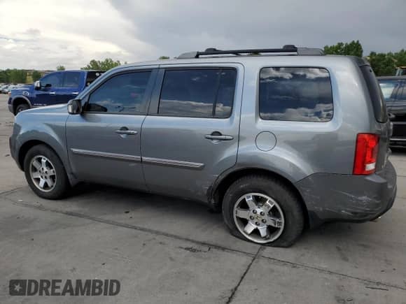 2009 Honda Pilot Touring with VIN 5FNYF48829B014693, listed as a Copart auction lot 65152355 with 160,961 mi miles and Salvage title. Bid and sale history available at DreamBid. Image 2.