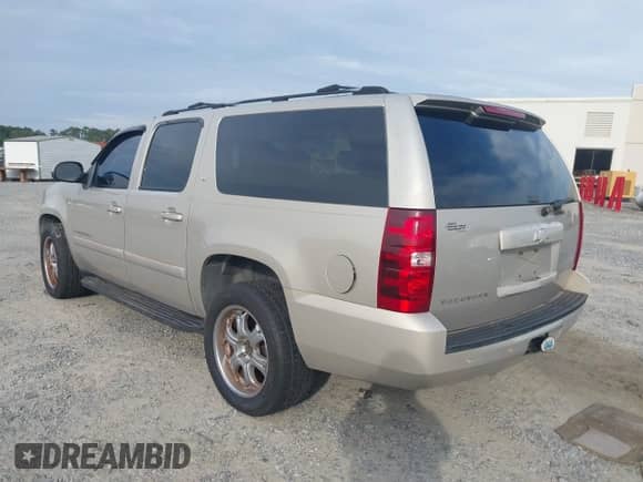 2007 Chevrolet Suburban LS with VIN 1GNFC16067J230068, listed as a IAAI auction lot 42366166 with 251,429 mi miles and . Bid and sale history available at DreamBid. Image 3.