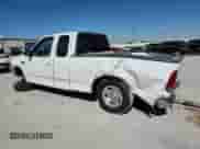 2003 Ford F-150 XL z VIN 2FTRX17L63CB07124, wystawiony jako Copart lot #86682935 z przebiegiem 101 788 mil mil oraz Szkoda całkowita • Salvage title. Historia ofert i sprzedaży dostępna na DreamBid. Obrazek 2.
