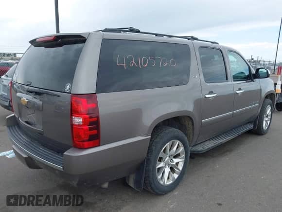 2014 Chevrolet Suburban LTZ with VIN 1GNSKKE77ER152503, listed as a IAAI auction lot 42105720 with 152,767 mi miles and . Bid and sale history available at DreamBid. Image 4.