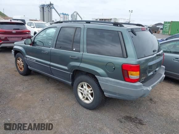 2003 Jeep Grand Cherokee Laredo with VIN 1J4GW48S23C610697, listed as a IAAI auction lot 43178617 with 227,331 mi miles and . Bid and sale history available at DreamBid. Image 3.