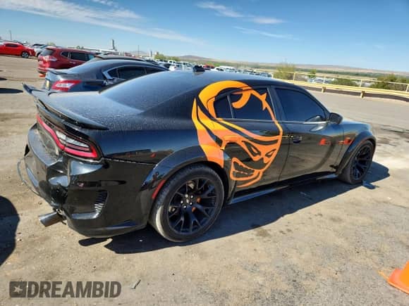 2023 Dodge Charger Scat Pack with VIN 2C3CDXGJ3PH508823, listed as a Copart auction lot 67311025 with 53,871 mi miles and Salvage title. Bid and sale history available at DreamBid. Image 3.