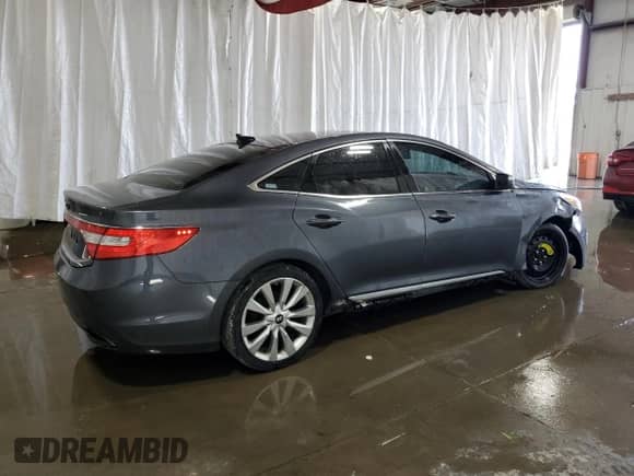 2013 Hyundai Azera z VIN KMHFH4JG2DA321197, wystawiony jako Copart lot #65585084 z przebiegiem 158 956 mil mil oraz Szkoda całkowita • Salvage title. Historia ofert i sprzedaży dostępna na DreamBid. Obrazek 3.