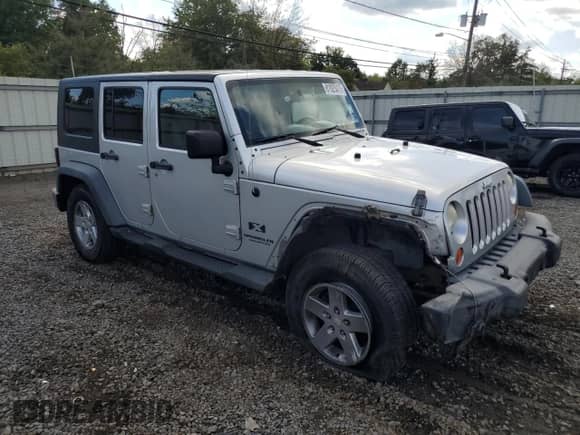 2007 Jeep Wrangler Unlimited X с VIN 1J8GA39157L198004, выставлен на аукционе Copart как лот 81825475 с пробегом 128 673 миль миль и Списание • Salvage title. История ставок и продаж доступна на DreamBid. Изображение 4.