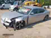 2010 Dodge Charger SXT with VIN 2B3CA3CV7AH126938, listed as a IAAI auction lot 42838919 with 188,868 mi miles and . Bid and sale history available at DreamBid. Image 2.