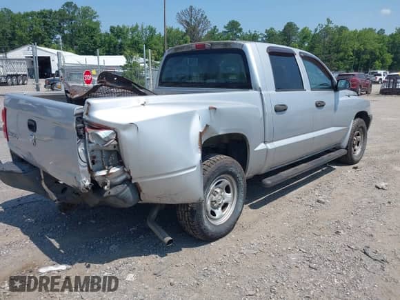 2006 Dodge Dakota ST z VIN 1D7HE28KX6S694544, wystawiony jako IAAI lot #42601154 z przebiegiem 82 199 mil mil oraz . Historia ofert i sprzedaży dostępna na DreamBid. Obrazek 4.