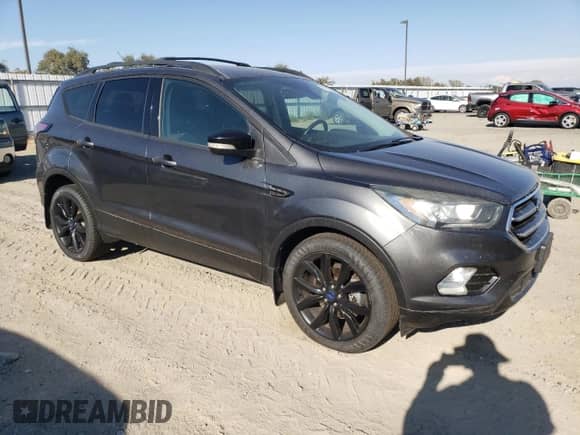 2017 Ford Escape Titanium z VIN 1FMCU9JD2HUC02846, wystawiony jako Copart lot #71730795 z przebiegiem 172 823 mil mil oraz Szkoda całkowita • Salvage title. Historia ofert i sprzedaży dostępna na DreamBid. Obrazek 4.