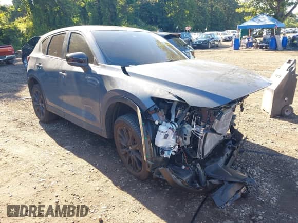 2025 Mazda CX-5 S Carbon Edition z VIN JM3KFBCM1S0584162, wystawiony jako IAAI lot #43044328 z przebiegiem 8 511 mil mil oraz . Historia ofert i sprzedaży dostępna na DreamBid. Obrazek 1.