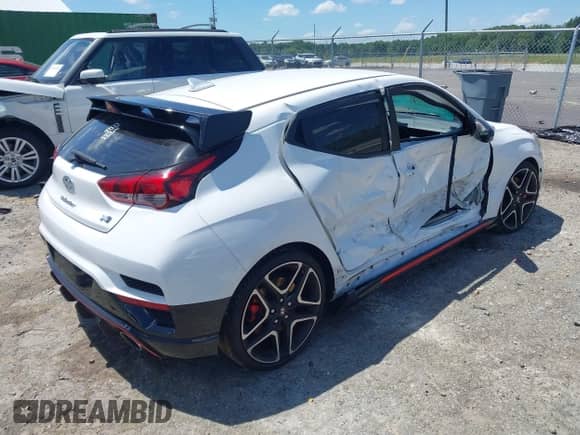 2022 Hyundai Veloster z VIN KMHT36AH3NU014434, wystawiony jako IAAI lot #42540378 z przebiegiem 28 106 mil mil oraz . Historia ofert i sprzedaży dostępna na DreamBid. Obrazek 4.