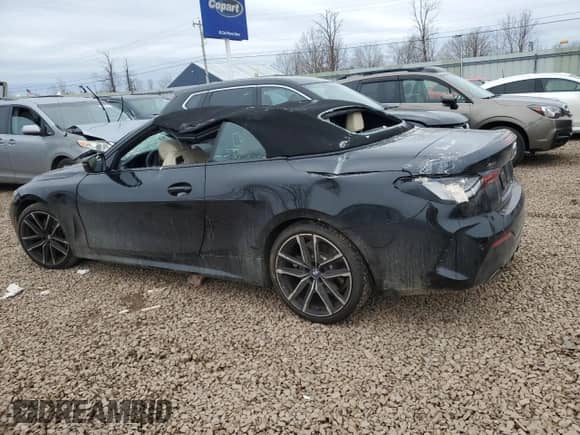 2023 BMW 4 Series 430i xDrive with VIN WBA43AT08PCM90476, listed as a Copart auction lot 50727785 with 11,677 mi miles and Salvage title. Bid and sale history available at DreamBid. Image 2.