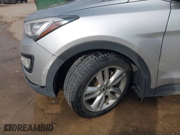 2014 Hyundai Santa Fe with VIN 5XYZW3LA1EG182451, listed as a IAAI auction lot 43389479 with 103,801 mi miles and . Bid and sale history available at DreamBid. Image 6.