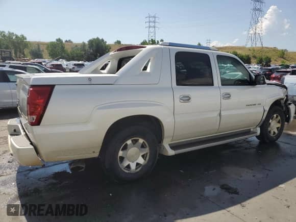 2002 Cadillac Escalade EXT with VIN 3GYEK63N62G352535, listed as a Copart auction lot 65949854 with 174,828 mi miles and Salvage title. Bid and sale history available at DreamBid. Image 3.