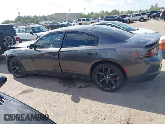 2021 Dodge Charger SXT with VIN 2C3CDXBG0MH633723, listed as a IAAI auction lot 43094395 with 76,533 mi miles and . Bid and sale history available at DreamBid. Image 14.