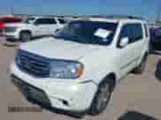 2014 Honda Pilot Touring with VIN 5FNYF3H95EB019027, listed as a IAAI auction lot 43424914 with 91,055 mi miles and . Bid and sale history available at DreamBid. Image 2.