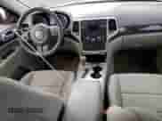 2011 Jeep Grand Cherokee 70th Anniversary with VIN 1J4RR4GGXBC563334, listed as a Copart auction lot 71876355 with 104,989 mi miles and Clean title. Bid and sale history available at DreamBid. Image 8.