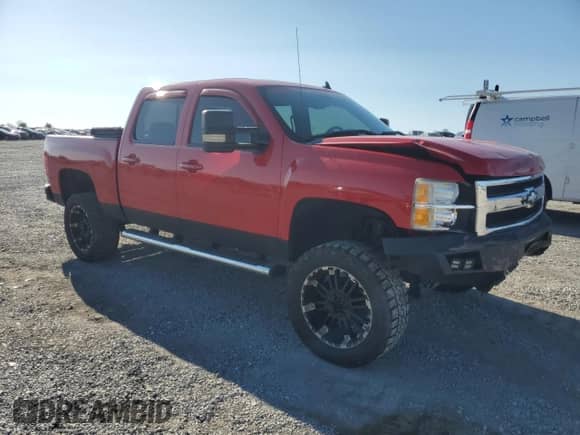 2009 Chevrolet Silverado 1500 LTZ with VIN 3GCEK33339G230826, listed as a Copart auction lot 71809015 with 198,069 mi miles and Salvage title. Bid and sale history available at DreamBid. Image 4.