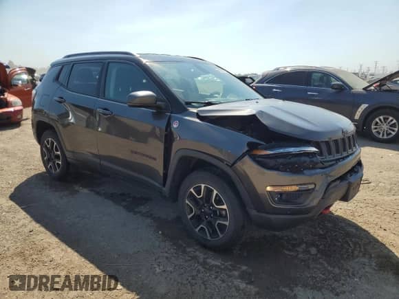2020 Jeep Compass Trailhawk with VIN 3C4NJDDBXLT163395, listed as a Copart auction lot 81366435 with 56,199 mi miles and Salvage title. Bid and sale history available at DreamBid. Image 4.