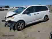 2014 Toyota Sienna L with VIN 5TDZK3DC4ES476425, listed as a Copart auction lot 81797975 with Not provided miles and Salvage title. Bid and sale history available at DreamBid. Image 1.
