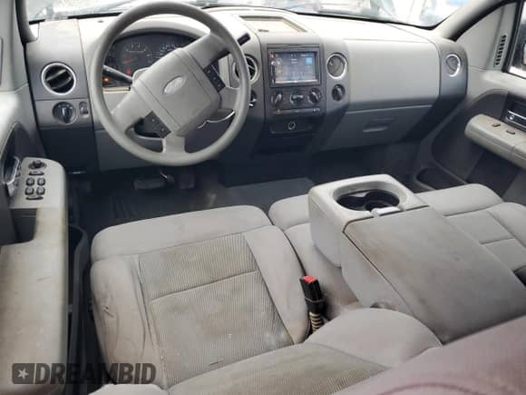 2005 Ford F-150 XLT with VIN 1FTPX12595NA46140, listed as a Copart auction lot 82141515 with 156,879 mi miles and Salvage title. Bid and sale history available at DreamBid. Image 8.