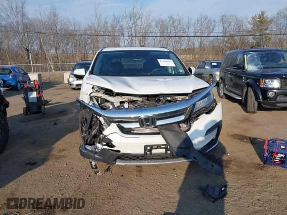 2021 Honda Pilot Touring 7-Passenger with VIN 5FNYF6H60MB037909, listed as a IAAI auction lot 41680637 with Not provided miles and . Bid and sale history available at DreamBid. Image 6.